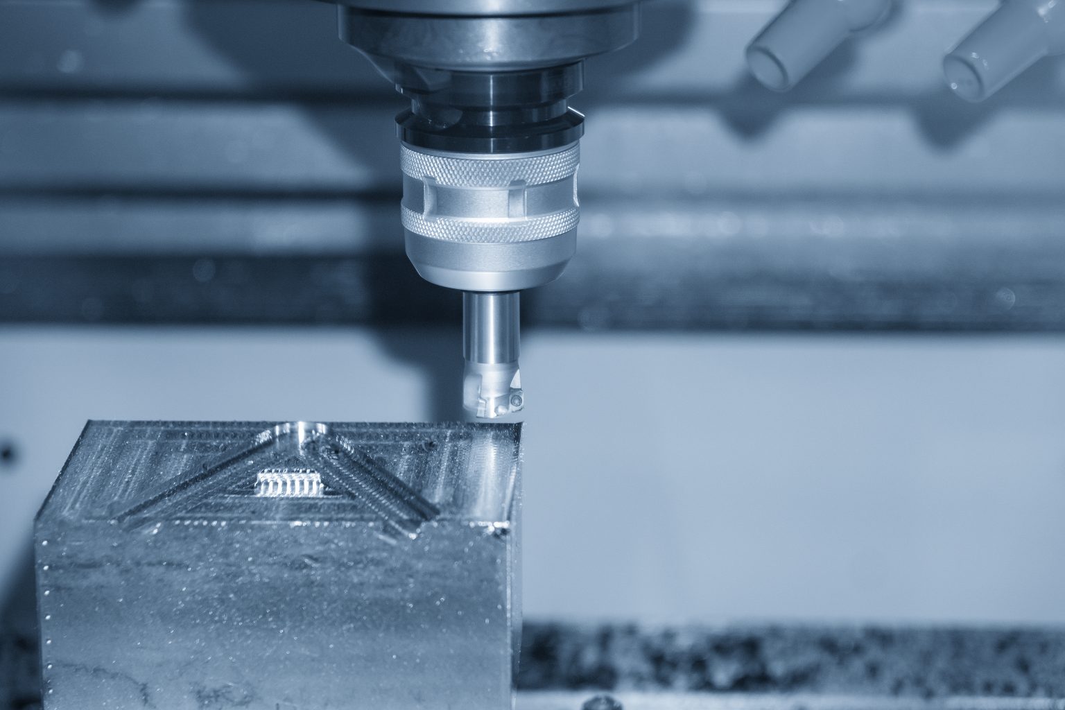 The CNC milling machine rough cutting the mould parts with the indexable radius endmill tools. The mold and die manufacturing process by machining centre with the indexable tools.